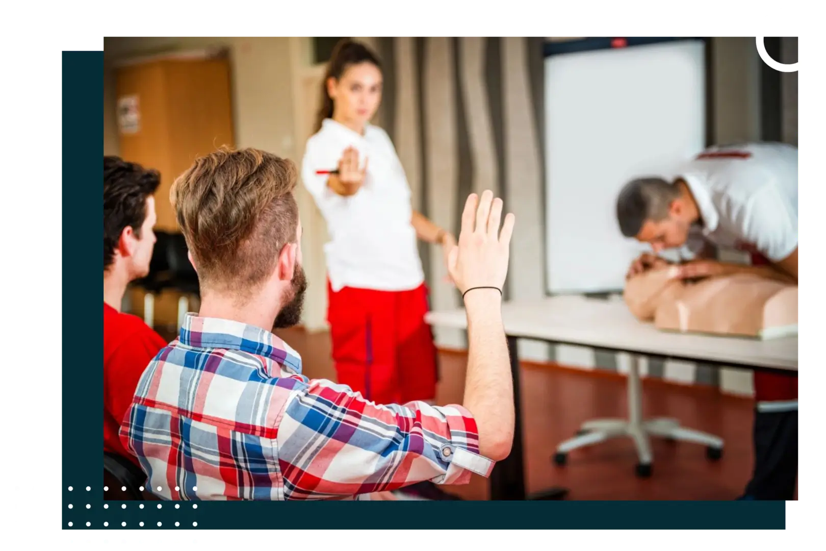 A group of people in front of a projector screen.